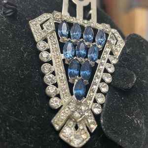 Signed but cannot read it. Blue and clear stones Fur clip
